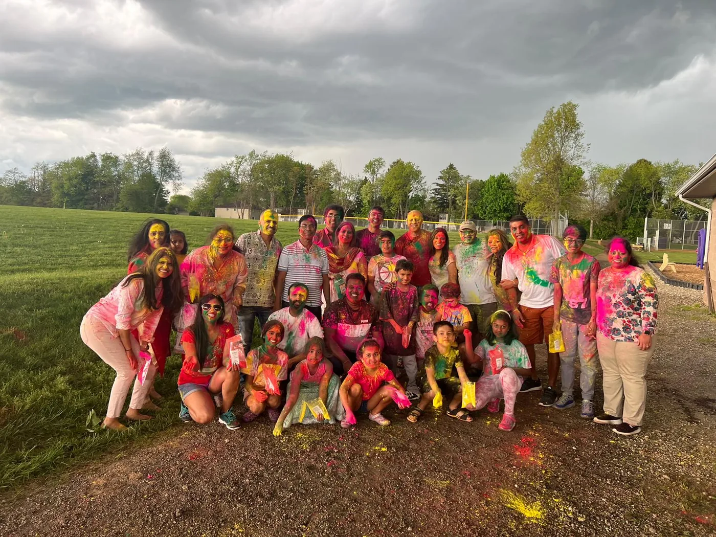 Families celebrating Holi with IAGC